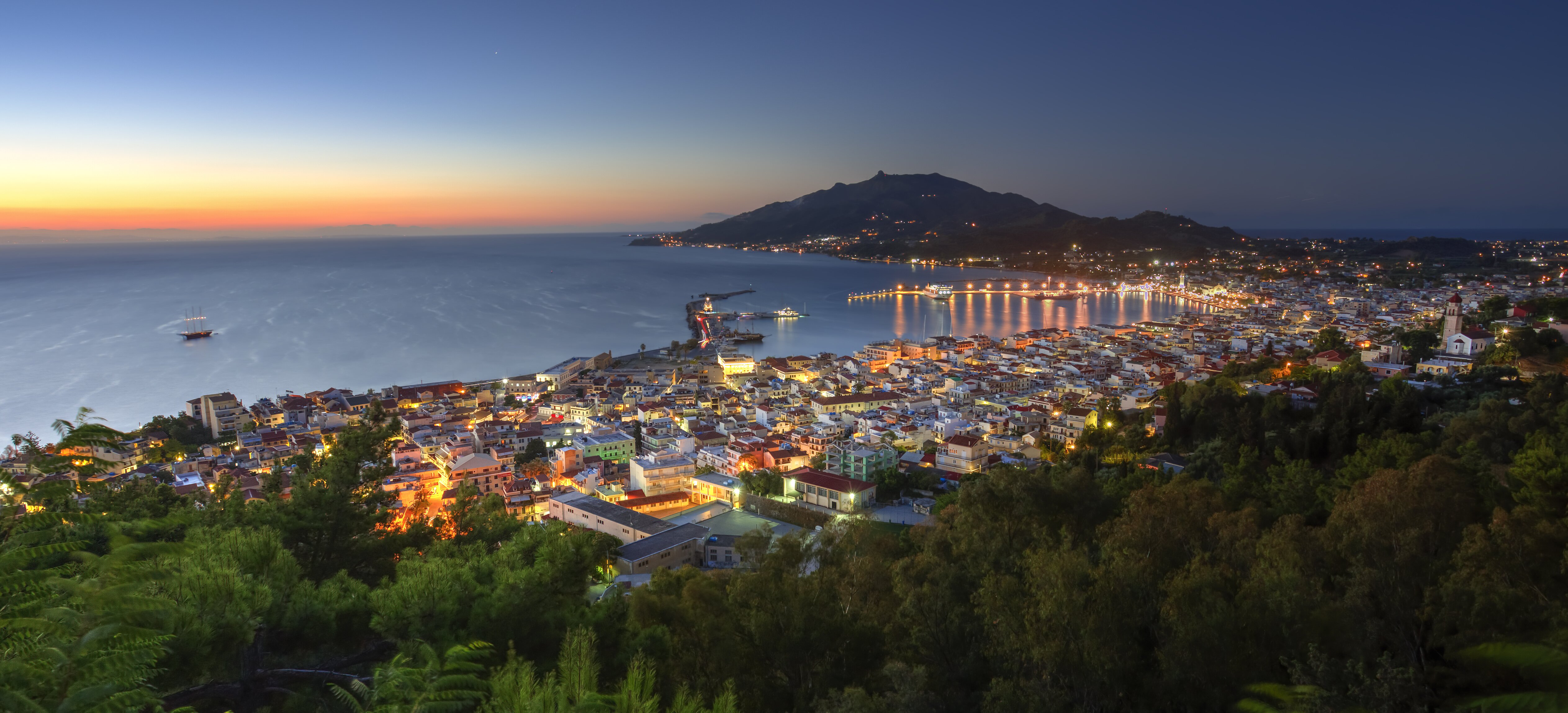City landscape with mountain and sea.