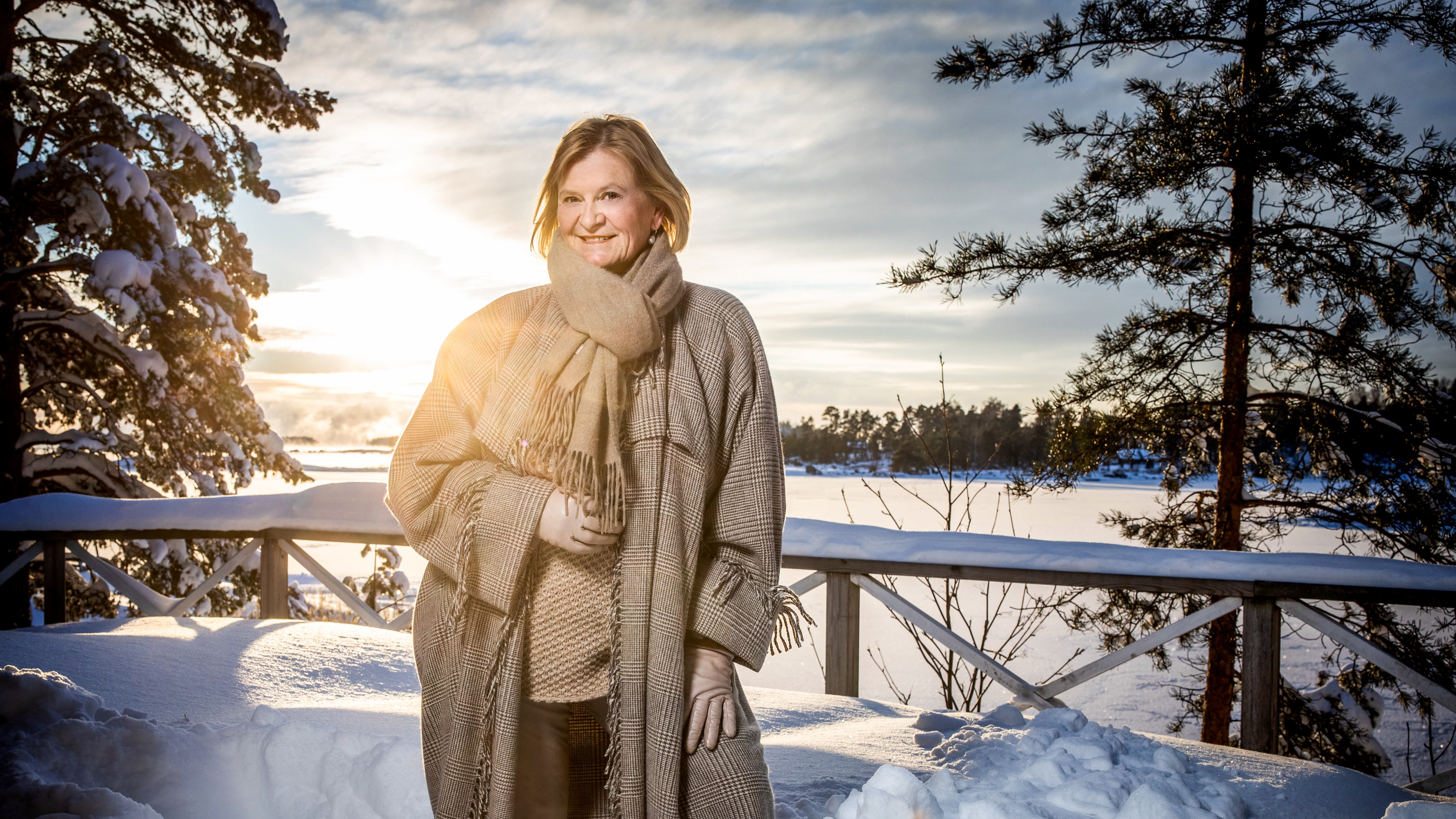 Marjo Miettinen, one of Ensto’s owners and Chairman of the Board, standing in a wintery landscape.