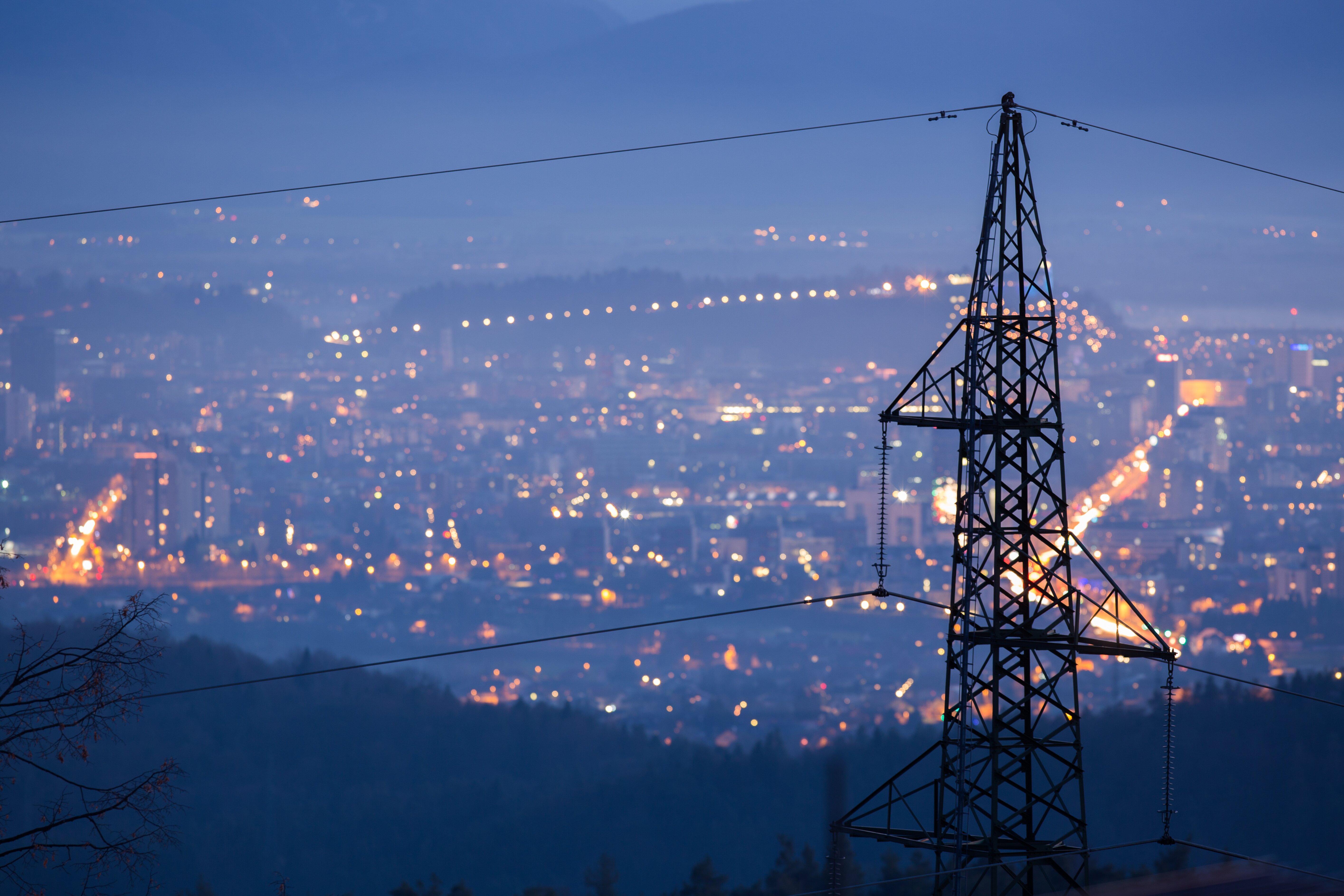 Transmission-line-with-city-lights.jpg